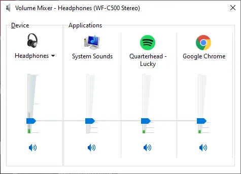Windows 11 Volume Mixer showing individual vertical volume sliders for System Sounds, Chrome browser, Spotify, and Microsoft Teams, each set to different levels
